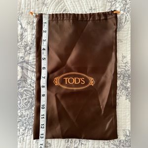 Tod’s satin dust bag. Hardware present.